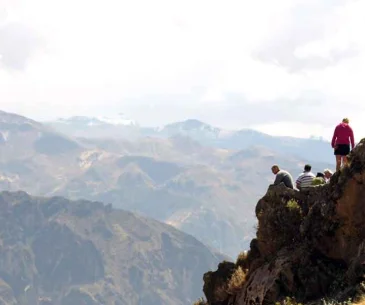 tourists enjoying colca canyon viewpoint scenic landscape peru