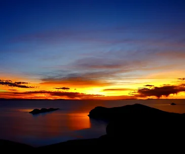sunset lake titicaca boat puno peru