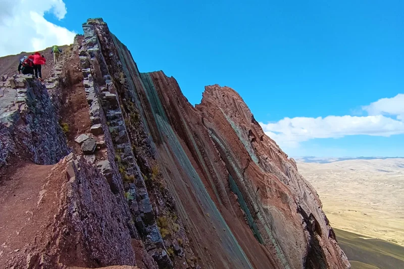 Pallay Punchu striped mountain visited in route between Puno and Cusco