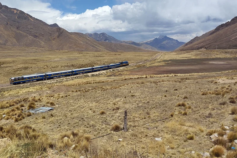Open-air observation car at the rear of the PeruRail Titicaca train